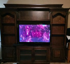 Cherry wood entertainment center and 40" tv