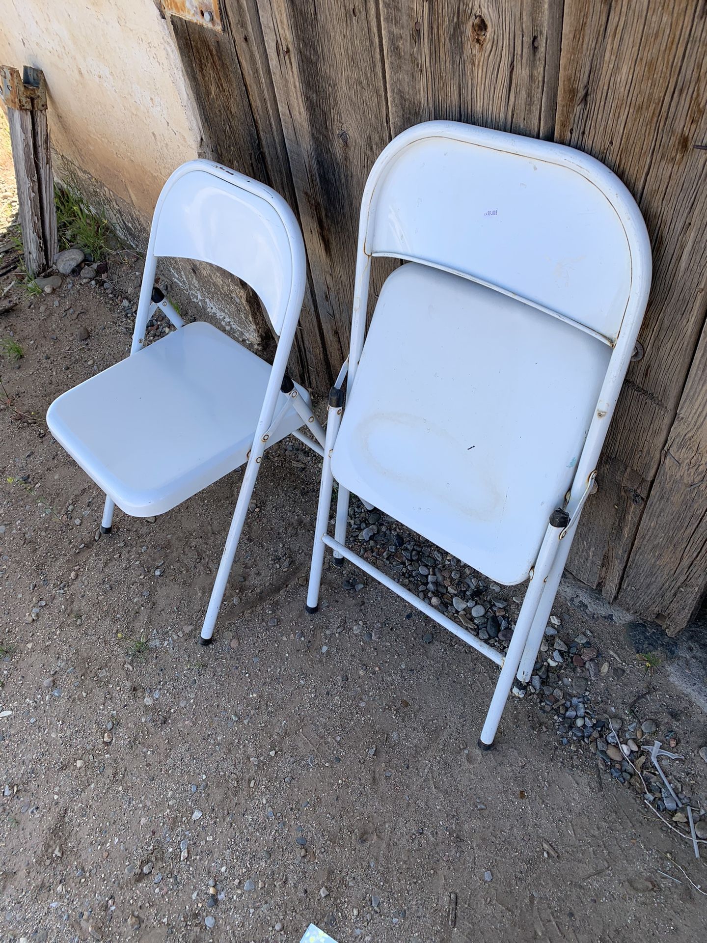 4 White Steel Folding Chairs. EACH