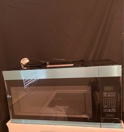 Amana over the range microwave 30”