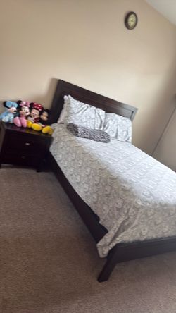 Queen size bed with mattress and side table