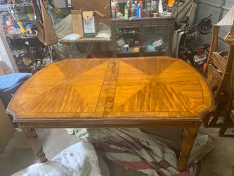 Ornate Wooden dining room table with 6 chairs
