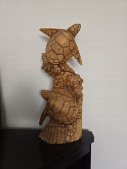 Wood sculpture of sea turtles