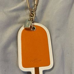 POPSICLE BAG CHARM BY COACH LIGHT GOLD/ORANGE