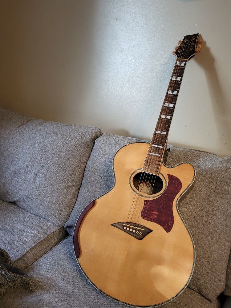Kona jumbo cutaway body acoustic guitar.
Playstation and sounds nice.