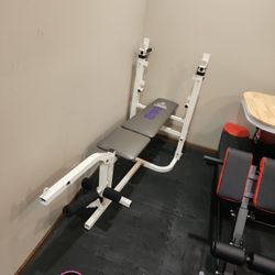 Weider bench press with leg press, 2) 25lb, 2) 15lb weights included