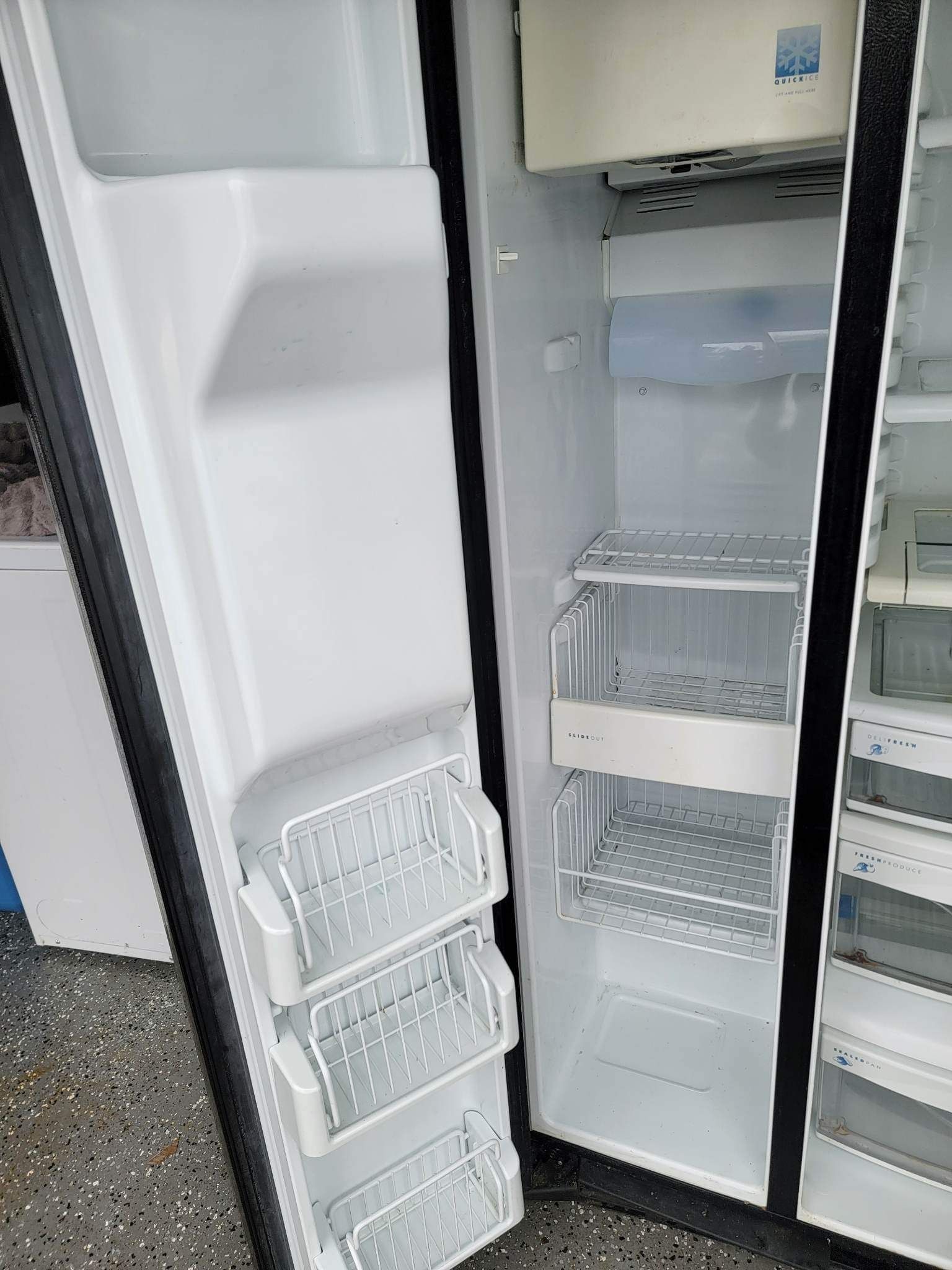 GE Side-by-side black side-by-side refrigerator in excellent