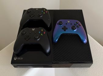 Xbox One in great condition with 3 controllers for sale.