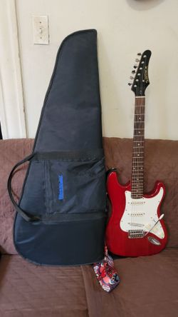 SAMICK 6 STRINGS ELECTRIC GUITAR MODEL LS -10TC MADE IN KOREA IN 2002 IN RED COLOR.
