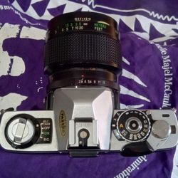  Minolta logo and Vivitar  Lens
