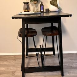 coffee table and dining room table with stools. 