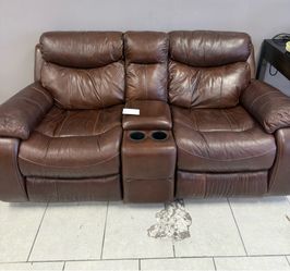 Brown leather love seat