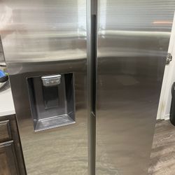2 Month Old Stainless Samsung Side by Side Refrigerator.  In brand new condition.  