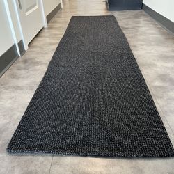 Two runner rugs - grey and black - $20 each