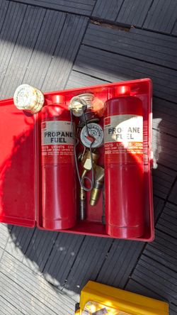 Vintage propane torch/soldering kit in the original red plastic case. Maybe in  empty cans.