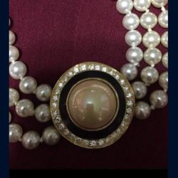 quality pearl necklace with front charm.
