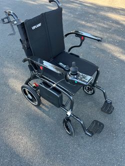 Brand new graphite, electric, Wheel Chair worth $1000
