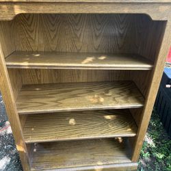 solid wood shelf its 49 inches tall 33 inches wide and 13 inches deep