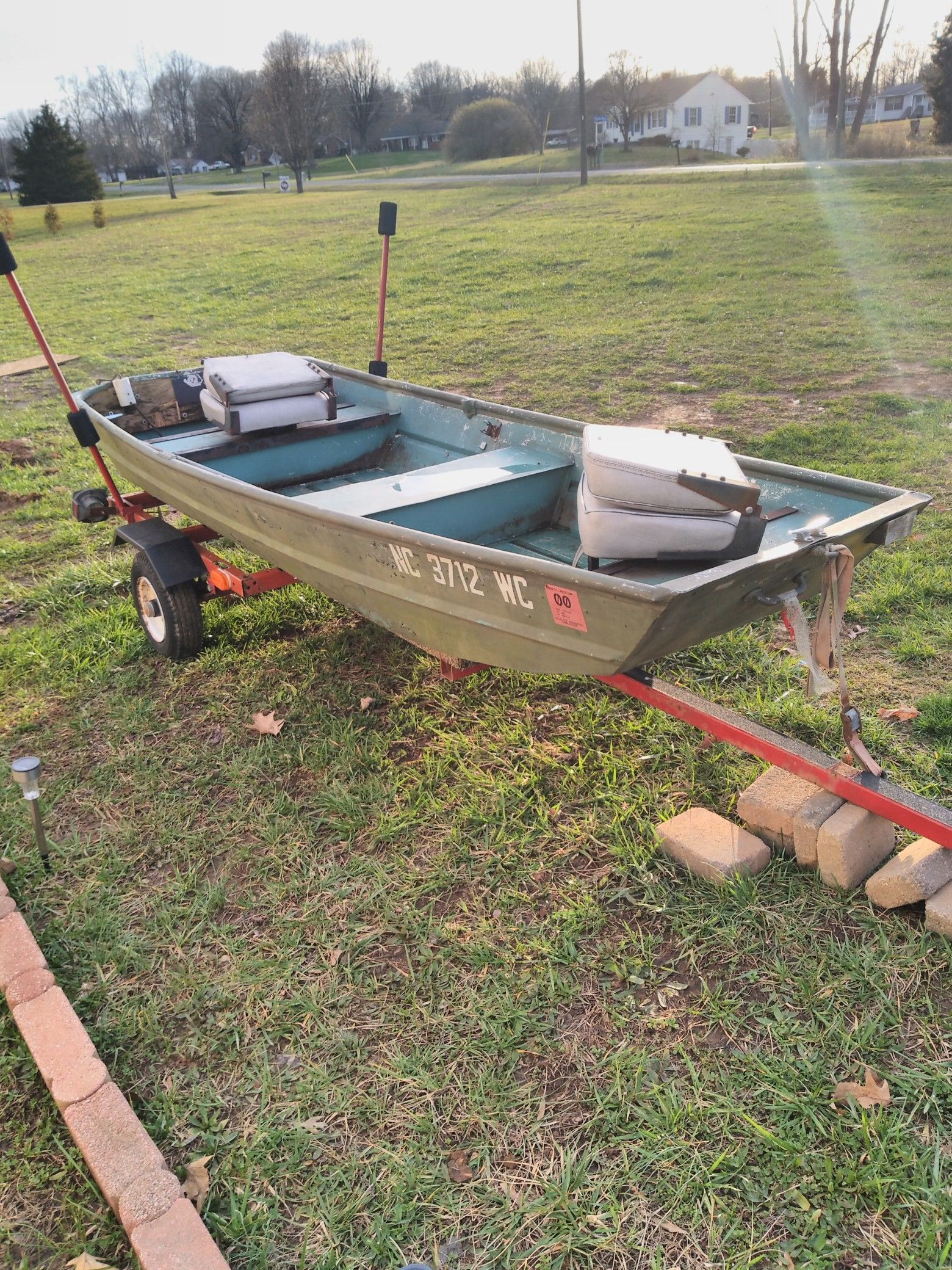 Boat and trailer and trolling motor cash or trade for four-wheeler has to be nice and running