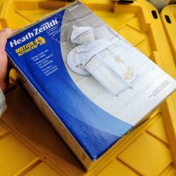 The Heath Zenith HZ-4132-MW Matte White Motion Sensor Outdoor Wall Sconce