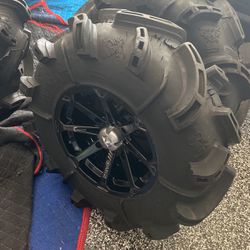 Can-Am ATV side-by-side staggered wheels and tires less than 30 minutes on them
