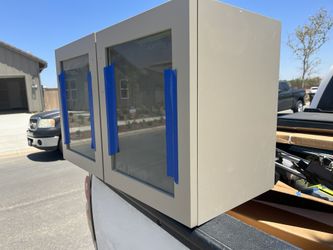 NEW CABINET WITH GLASS DOORS ALSO WITH HARDWARE AND TRIM