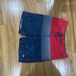 Quiksilver beach shorts, blue/red, size 28/14 youth