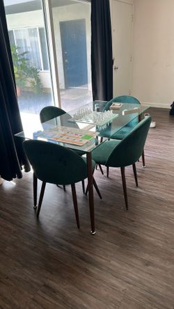 Glass dining room tables with chairs.