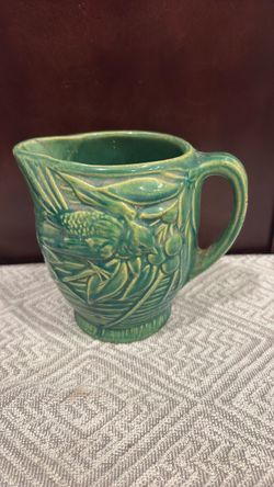 Green Ceramic Pitcher with Embossed Floral Design