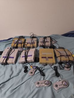 7 Super Nintendo consoles with 20 games