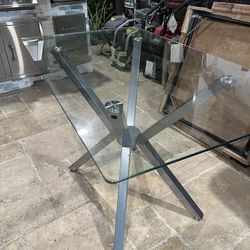Glass table with silver base
