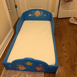 Cocomelon toddler bed with toddler/crib mattress.