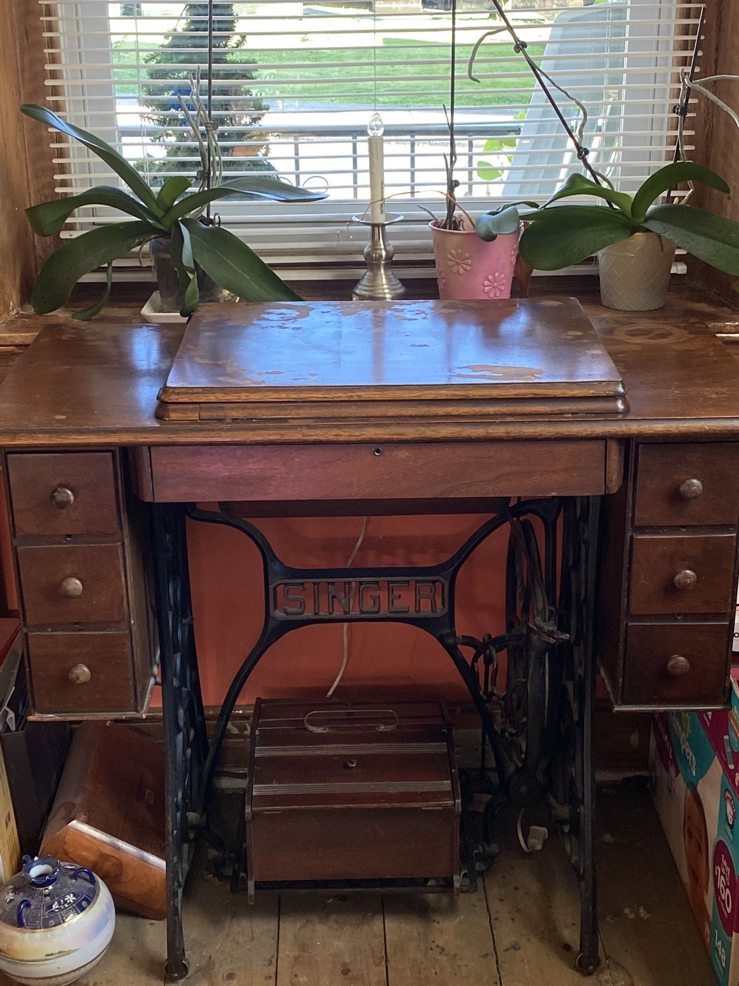 Vintage singer sewing machine in cabinet and wooden sewing box