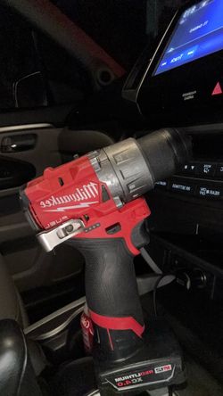 Milwaukee Hammer drill driver with 4.0 square battery.