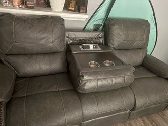 Two gray leather sofas