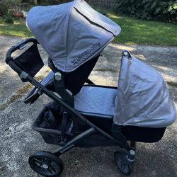 UppaBaby stroller with bassinet and child seat fits two