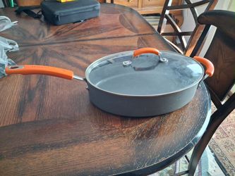 Rachael Ray 5-Quart Hard-Anodized Nonstick Oval Saute Pan with Lid and orange handles
