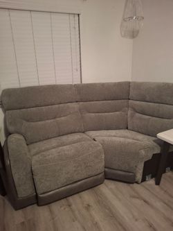 Dark Gray recliner, with a corner piece. It is two pieces, seventy