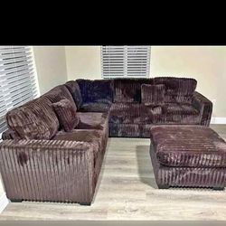 Brown Jumbo corduroy sectional sofa with ottoman