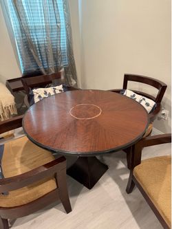 Table 42x28h… chair 31w, 30h.  cushion height 29, 23d… 4 chairs