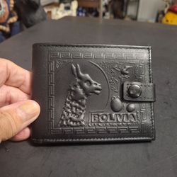 Genuine Leather Embossed Bifold Wallet, Bolivia Featuring A Llama Motif Embossed, Leather Strap Snap Closure -Black