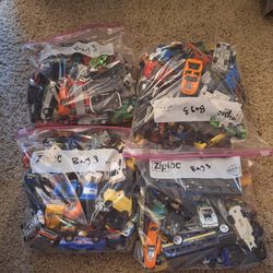 4 bags Of Assorted Cars