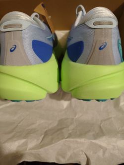ASICS Men's Gel-Kayano 30 Lite-Show running shoes feature a distinctive Sea Glass blue upper with a neon green midsole