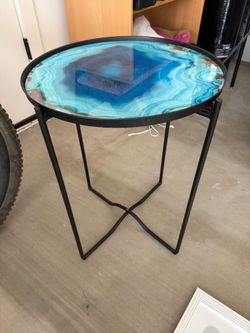 Pair of glass top tables and metal stands
