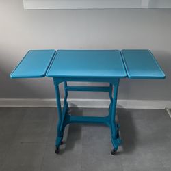 Teal Metal Table On Wheels- Folds To Smaller