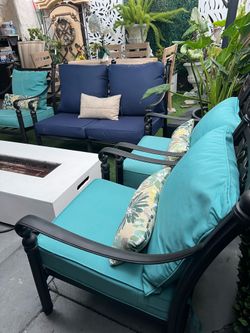 Beautiful 4-piece cast aluminum patio set with new cushions.
