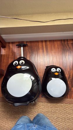 Heys America Travel Tots (Emperor Penguin), Tucci Italy (Penguin Buddy)
