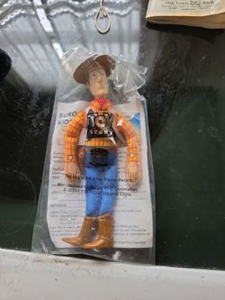 1995 Burger King Toy Story Woody promotional figure still sealed in its original Kids Club plastic packaging