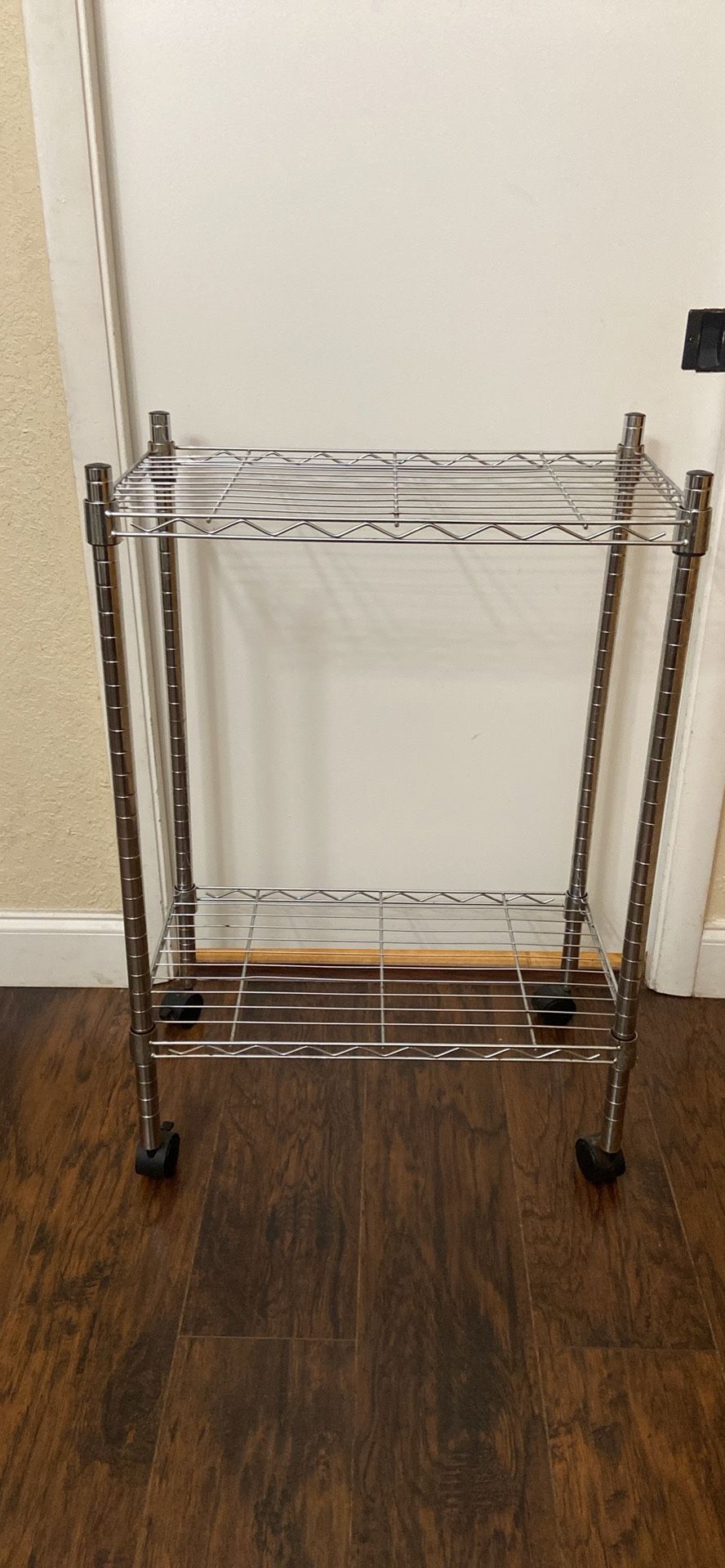 Metal Shelf Rack, 2 adjustable levels, 4 wheel. H35”,Deep14”, W24”. West Boca