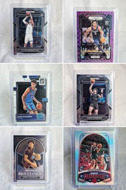 NBA Rookie Sports Cards Lot Including Victor wembanyama, Stephon Castle, Chet Holmgren and more.