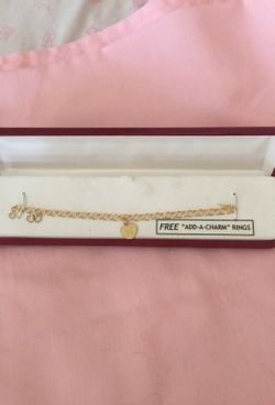 14 Kt gold bracket with Love charm